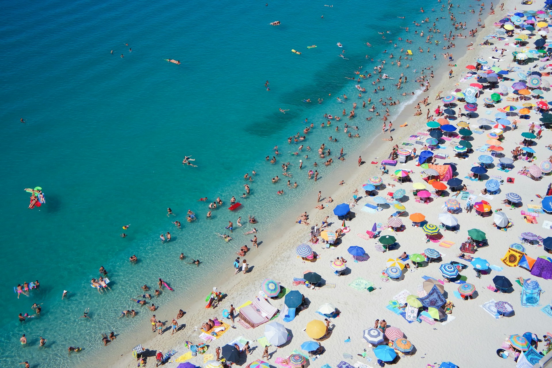 beach with a crowd of people